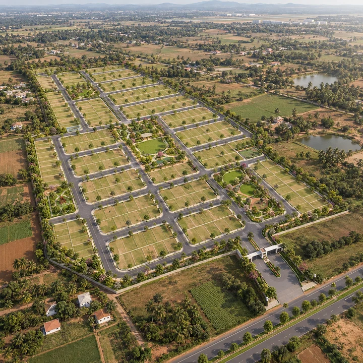 Aerial artistic impression of Vaishnavi AT-One Life Phase 4 showing the plotted layout, internal roads and parks